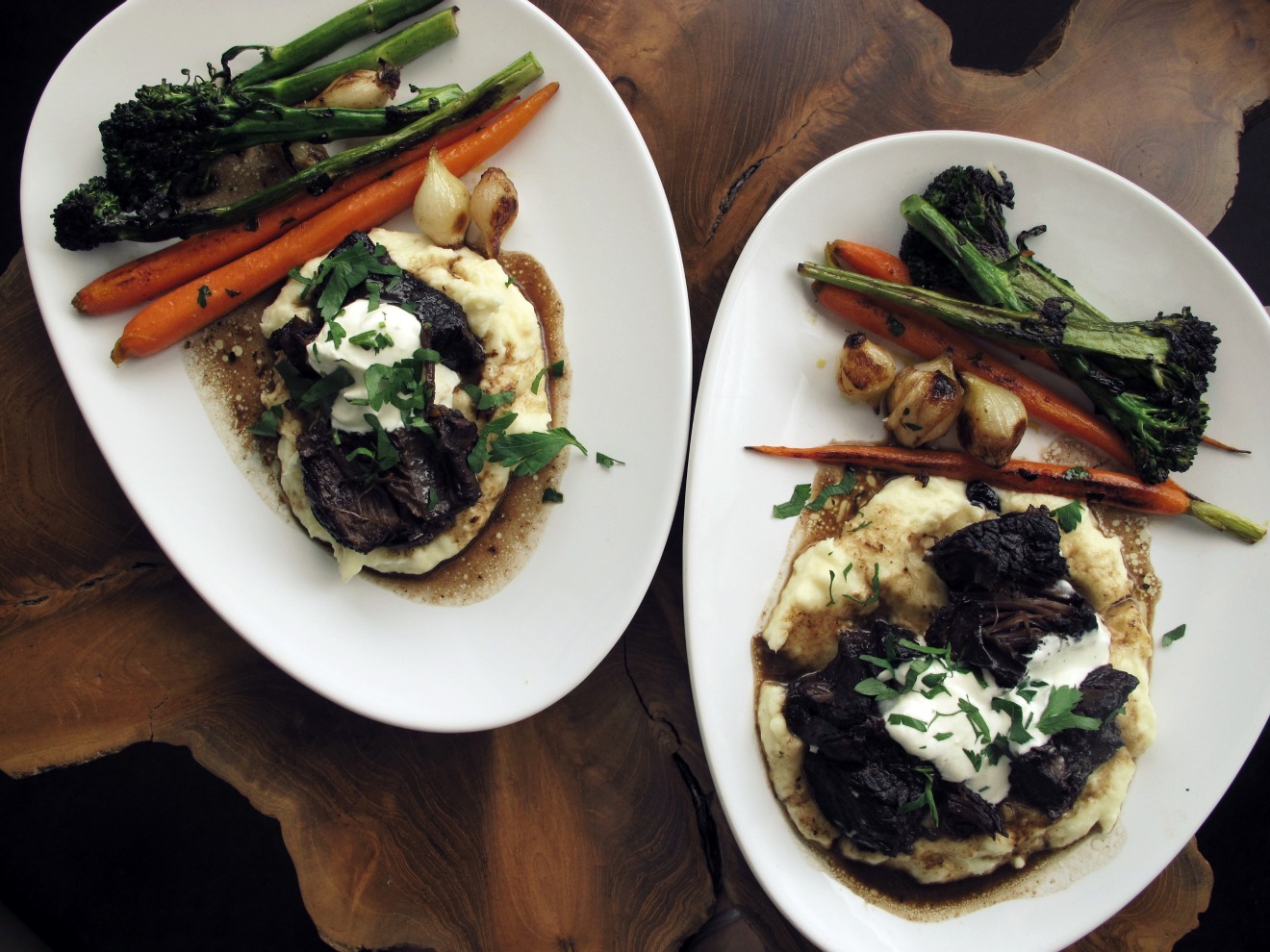 plated briased short rib with parsnip puree and roasted vegetables